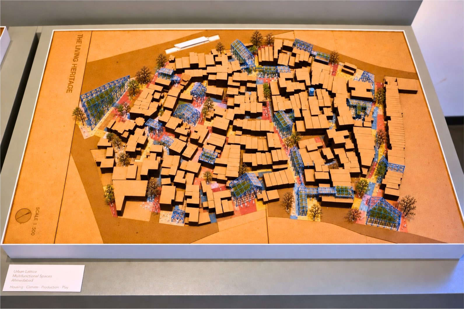 The model. The village whole, with the interventions built into the pockets where the boundaries overlap.