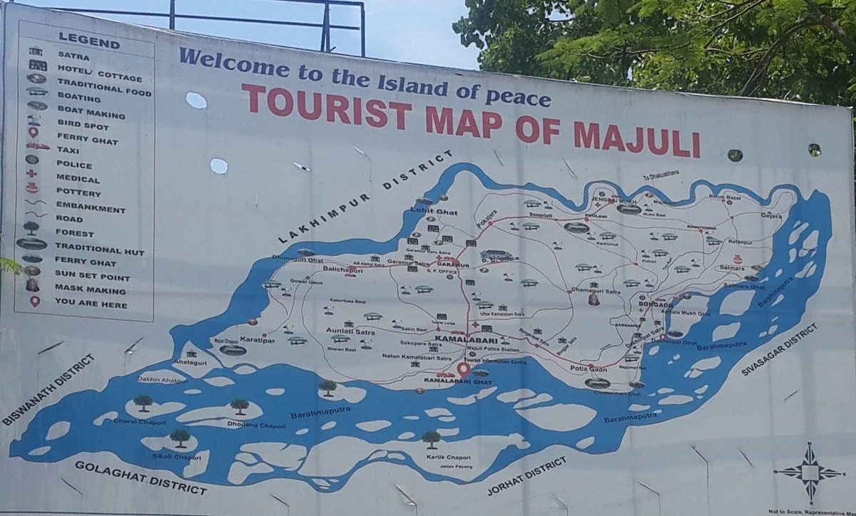 Welcome to the island of peace. The tourist map at Kamalabari ghat: the satras, the ferry ghats, the embankments, and the districts across the water.