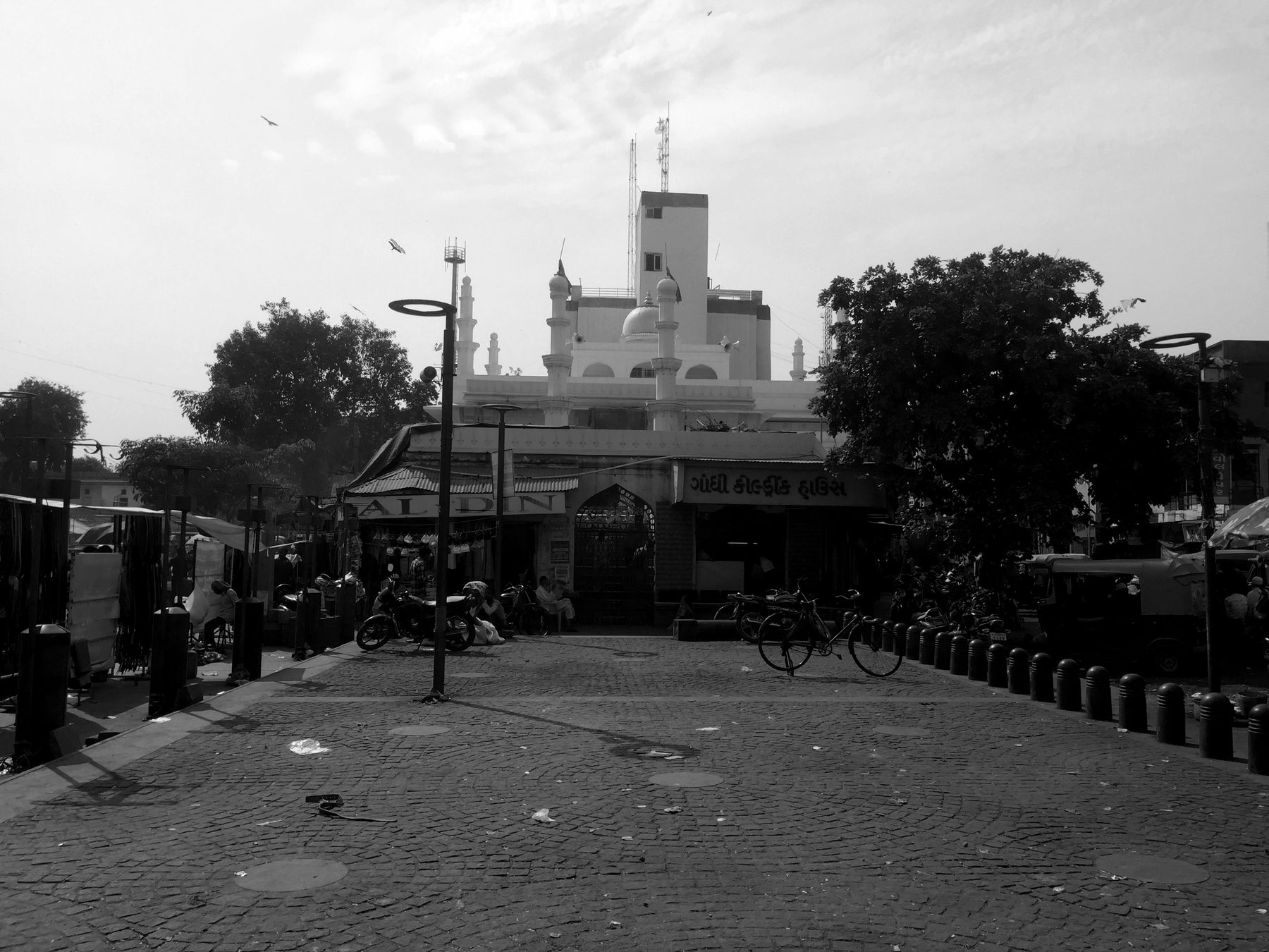 The plaza at dawn. The redesigned floor, empty, before the vendors arrive.