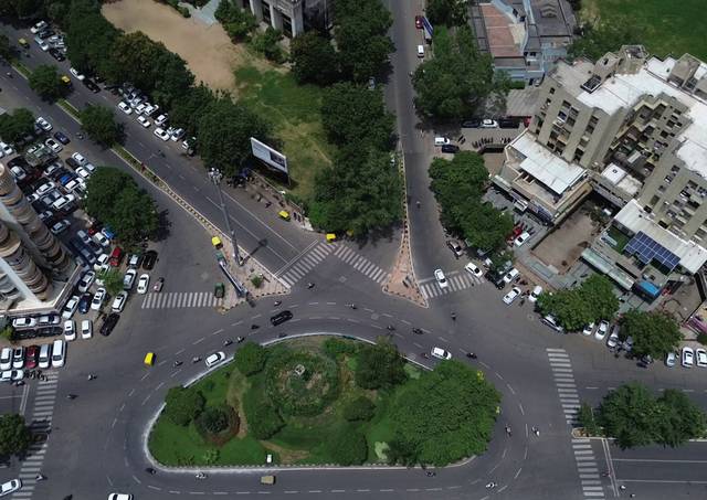 A junction green. The traffic island planted.